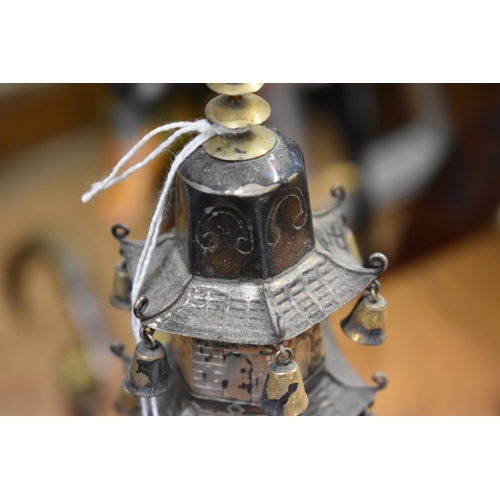 1767 - A Chinese metal pagoda temple, 34cm high.