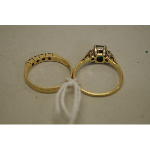 128 - An emerald and diamond gold ring; together with another example set four inline emeralds, both hallm... 