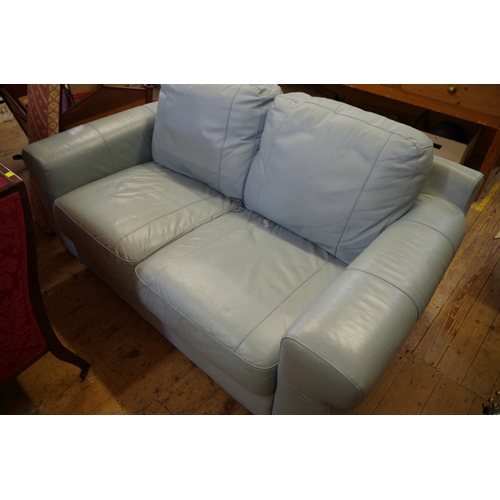 1357 - A contemporary pale blue leather two seater sofa, 170cm wide. 