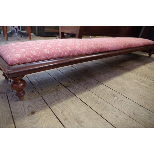 1365 - An old long low footstool, on turned legs, 125cm long.