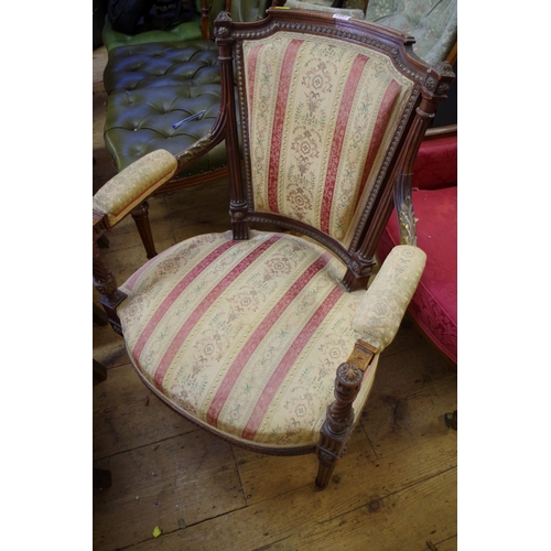 1367 - A pair of late 19th century carved mahogany and parcel gilt open arm elbow chairs. 