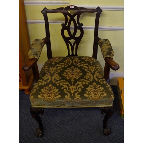 1371 - An 18th century Irish red walnut elbow chair, on cabriole legs with hairy paw feet to the front.... 