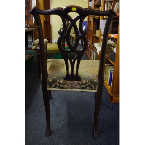 1371 - An 18th century Irish red walnut elbow chair, on cabriole legs with hairy paw feet to the front.... 