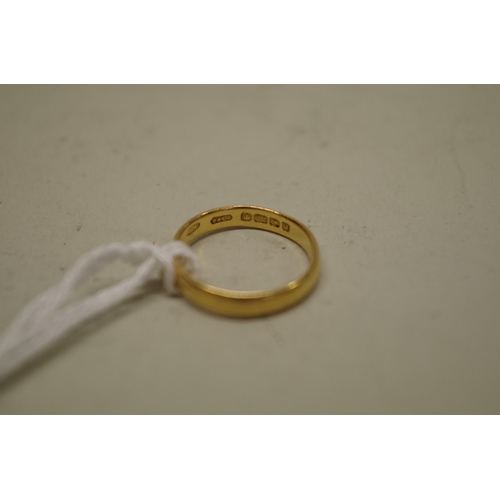 145 - Two gold wedding bands, stamped 22ct, 7.9g.