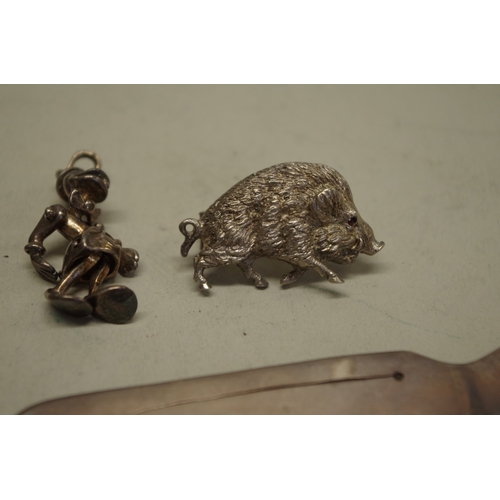 164 - A metal boar brooch; together with three charms; a silver bookmark and other items. (8)... 