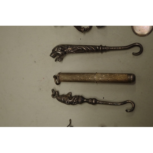 164 - A metal boar brooch; together with three charms; a silver bookmark and other items. (8)... 