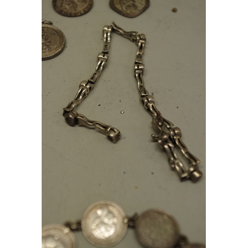 168 - A quantity of silver and other metal necklaces, bracelets etc.