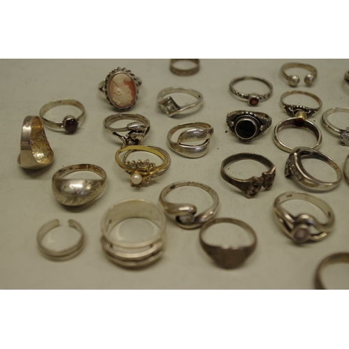 169 - A collection of silver and other metal rings.