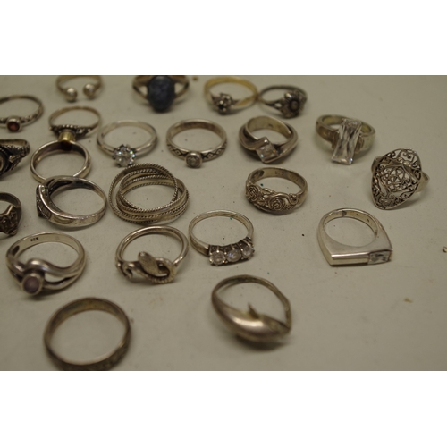 169 - A collection of silver and other metal rings.