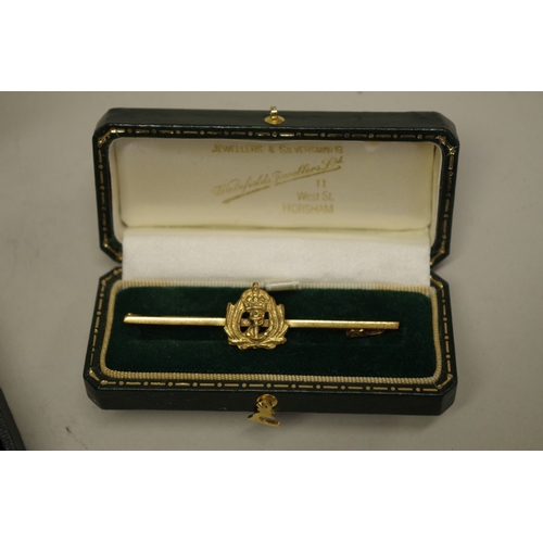 181 - A silver hinged bangle; together with a regimental bar brooch; and a modern ladies wristwatch.... 