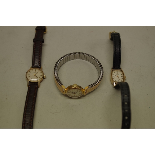 233 - Two Omega 9ct gold ladies wristwatches; together with a gold plated example. (3)