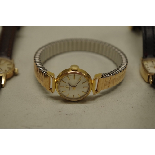 233 - Two Omega 9ct gold ladies wristwatches; together with a gold plated example. (3)