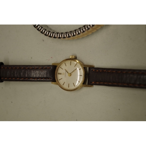 233 - Two Omega 9ct gold ladies wristwatches; together with a gold plated example. (3)