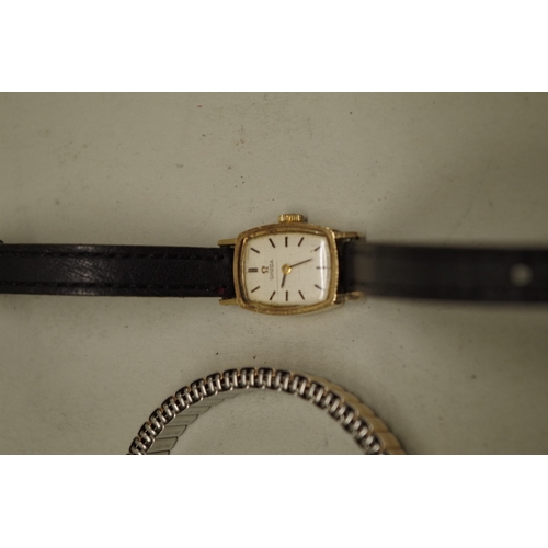 233 - Two Omega 9ct gold ladies wristwatches; together with a gold plated example. (3)