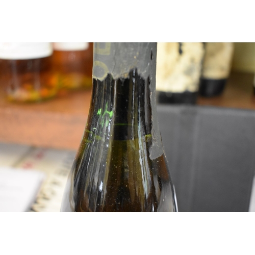 514 - An old half bottle of Moet & Chandon champagne.Provenance: by repute brought back from the trenc... 