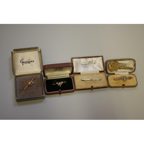 190 - A cased pearl set white gold bar brooch, stamped 9ct; together with a gold stock pin, stamped 10ct; ... 