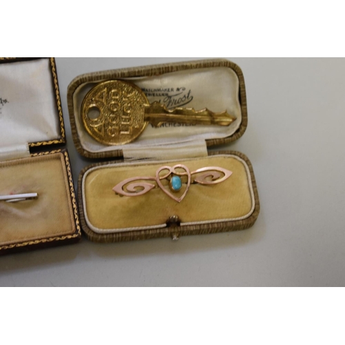 190 - A cased pearl set white gold bar brooch, stamped 9ct; together with a gold stock pin, stamped 10ct; ... 