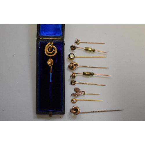 192 - A diamond set gold cravat pin, stamped 15ct; together with ten other unmarked examples.... 