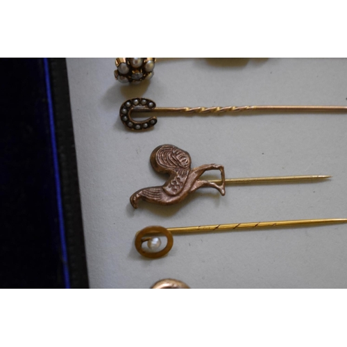 192 - A diamond set gold cravat pin, stamped 15ct; together with ten other unmarked examples.... 