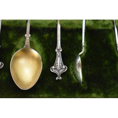 27 - A cased set of six late Victorian silver and gilt teaspoons and sugar tongs, by A J Bailey, Birmingh... 