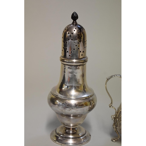 74 - An Edwardian silver castor, by Levi & Salaman, Birmingham 1905, 18.5cm high; together with an em... 