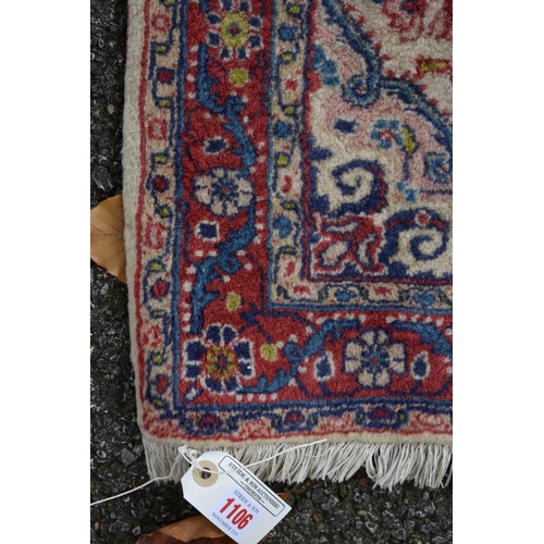 1106 - A small Persian rug, with allover floral design, 102 x 70cm.
