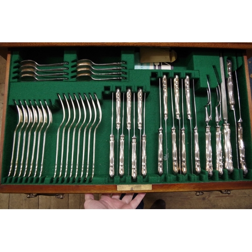 63 - A modern canteen of electroplate Dubarry pattern cutlery for eight. by Dixon, in mahogany two drawer... 