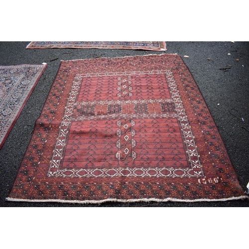 1135 - An Eastern square rug, having allover geometric design on a red ground, 192 x 166cm.... 