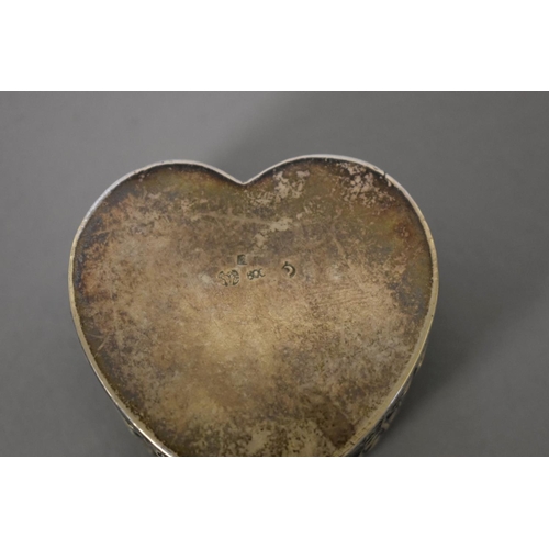24 - A Continental .800 heart shaped trinket box; together with a sterling silver Vermouth label.... 