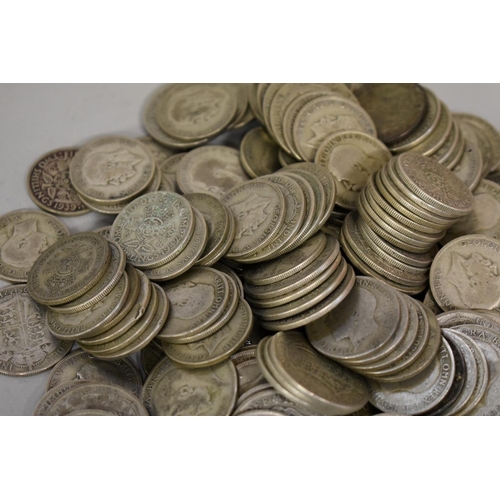 290 - Coins: a large quantity of George V and George IV half crowns and florins, 2511g.