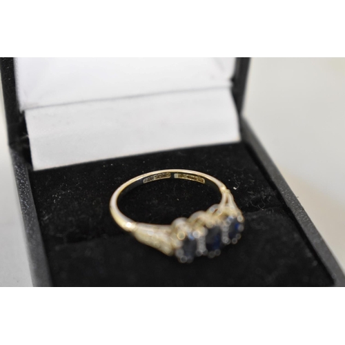 65 - A sapphire and diamond white gold and platinum ring, hallmarked 18ct & plat, 2.6g total weight.... 