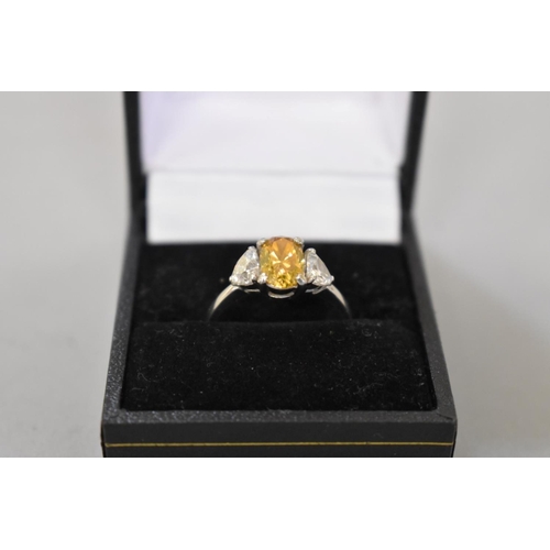 66 - A yellow and white diamond three stone platinum ring, hallmarked .950, central diamond 1.5ct ap... 