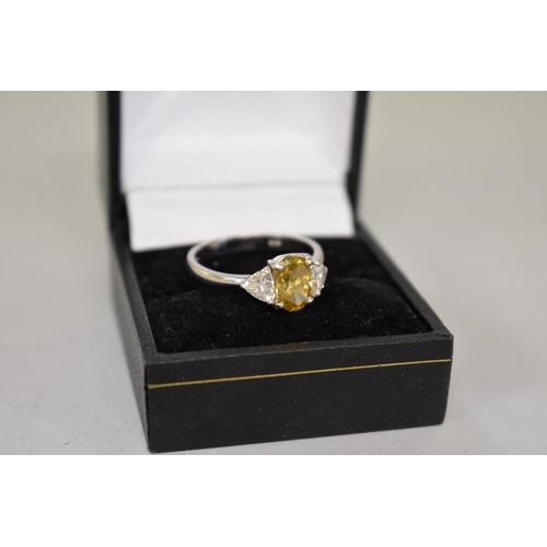 66 - A yellow and white diamond three stone platinum ring, hallmarked .950, central diamond 1.5ct ap... 