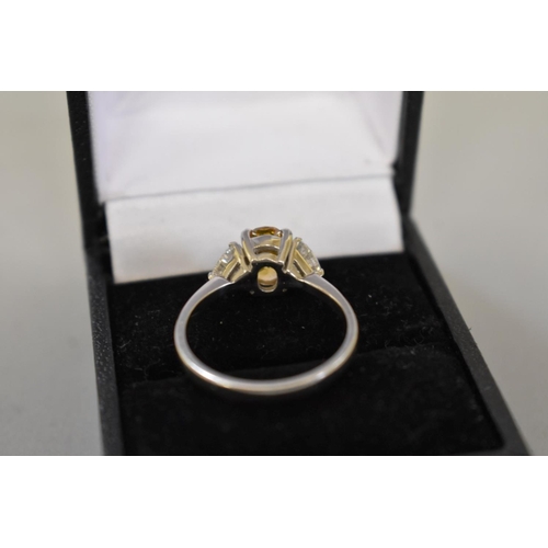 66 - A yellow and white diamond three stone platinum ring, hallmarked .950, central diamond 1.5ct ap... 