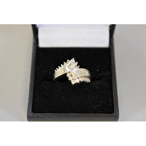 71 - A baguette and brilliant cut diamond white gold ring, hallmarked 750, of approximately 1ct, 6.5g tot... 