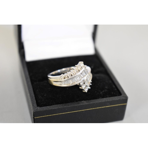 71 - A baguette and brilliant cut diamond white gold ring, hallmarked 750, of approximately 1ct, 6.5g tot... 