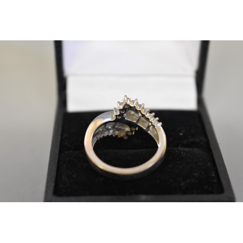 71 - A baguette and brilliant cut diamond white gold ring, hallmarked 750, of approximately 1ct, 6.5g tot... 