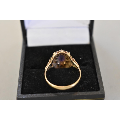 72 - An amethyst and pearl gold ring, hallmarked 9ct, 3.7g total weight.