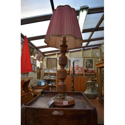 1198 - An Indian carved teak table lamp. 