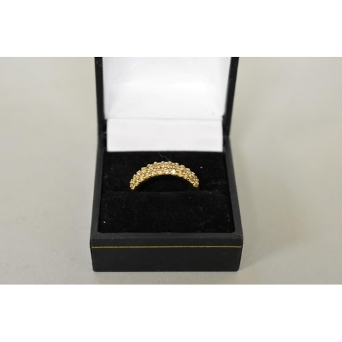 410 - A fancy yellow diamond pave set gold ring, hallmarked 9ct, 0.4ct approximately, 2.7g total weight.... 