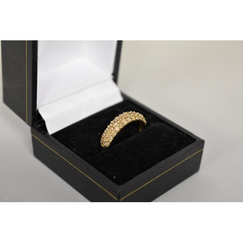 410 - A fancy yellow diamond pave set gold ring, hallmarked 9ct, 0.4ct approximately, 2.7g total weight.... 