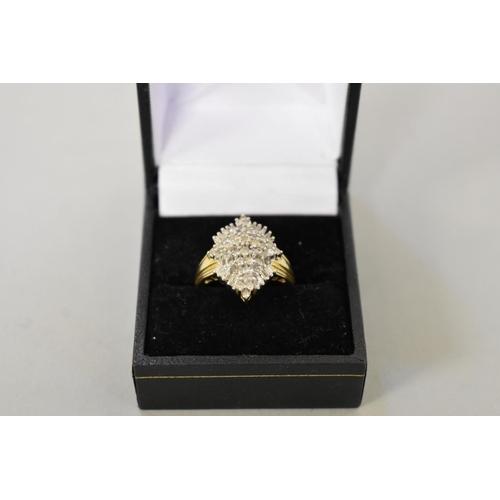 412 - A baguette and brilliant cut diamond cluster gold ring, hallmarked 14ct, 1ct approximately, 6.1g tot... 