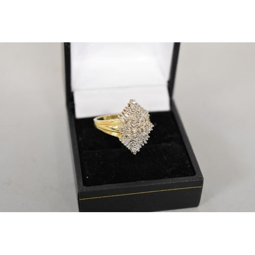 412 - A baguette and brilliant cut diamond cluster gold ring, hallmarked 14ct, 1ct approximately, 6.1g tot... 