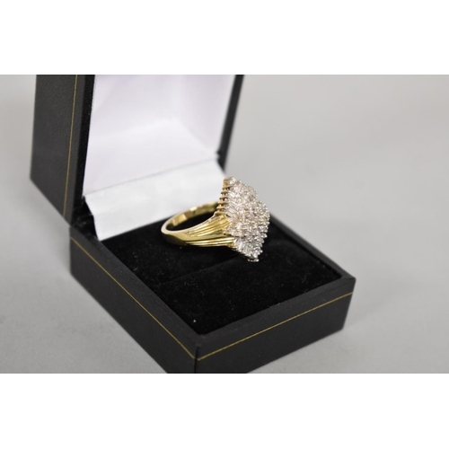 412 - A baguette and brilliant cut diamond cluster gold ring, hallmarked 14ct, 1ct approximately, 6.1g tot... 