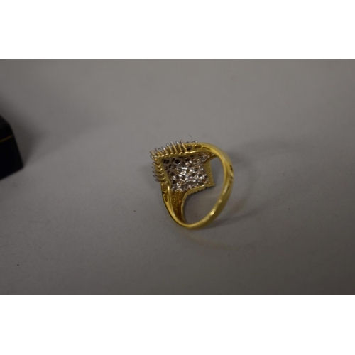 412 - A baguette and brilliant cut diamond cluster gold ring, hallmarked 14ct, 1ct approximately, 6.1g tot... 