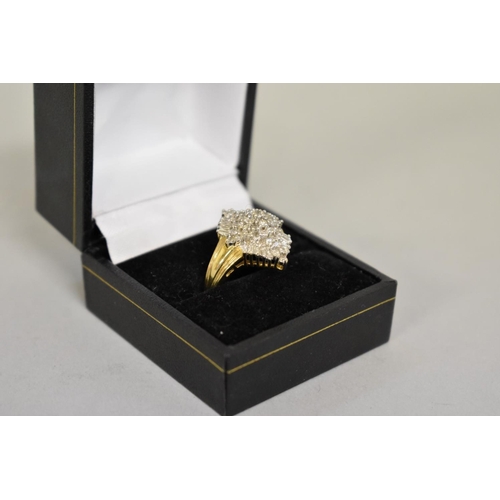 412 - A baguette and brilliant cut diamond cluster gold ring, hallmarked 14ct, 1ct approximately, 6.1g tot... 