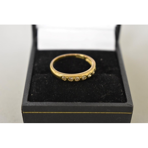 413 - A diamond seven stone half eternity gold ring, hallmarked 9ct, 1.8g total weight.... 