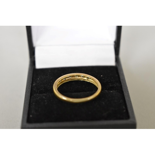 413 - A diamond seven stone half eternity gold ring, hallmarked 9ct, 1.8g total weight.... 