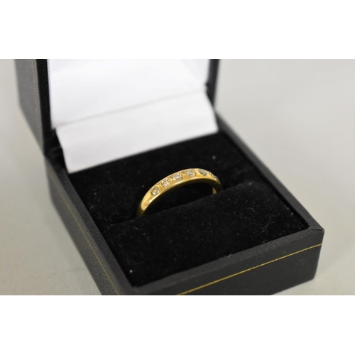 413 - A diamond seven stone half eternity gold ring, hallmarked 9ct, 1.8g total weight.... 