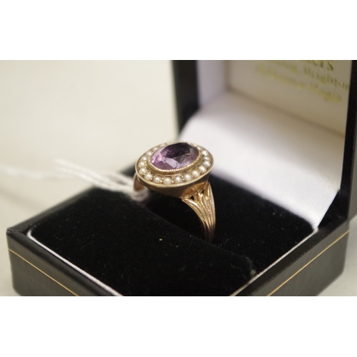 414 - An oval amethyst and pearl unmarked yellow metal ring, 3.4g total weight.